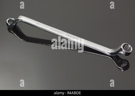 ring profile matal spanner on dark background Stock Photo