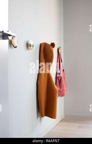 Modern hallway interior with clothes on hanger Stock Photo