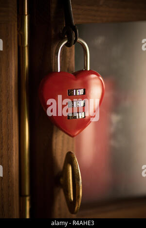 Close up shot of a heart-shaped padlock with numbers. Stock Photo
