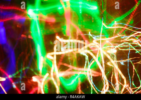 Defocused abstract multicolored bokeh lights background. Blue, purple, green, orange colors Stock Photo