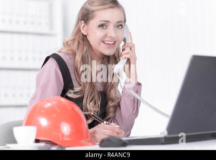 professional talking on phone in architect office Stock Photo