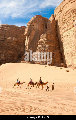 camel ride, tourist riding dromedaries, Wadi Rum, Jordan, Asia, (Camelus dromedarius) Stock Photo