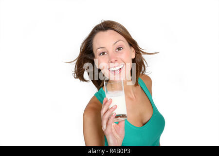 Beautiful girl drinking milk from glass Stock Photo