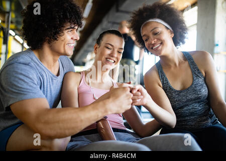 Happy gorup of healthy people training in gym Stock Photo