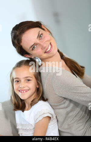 Portrait of mother and daughter in tender moment Stock Photo