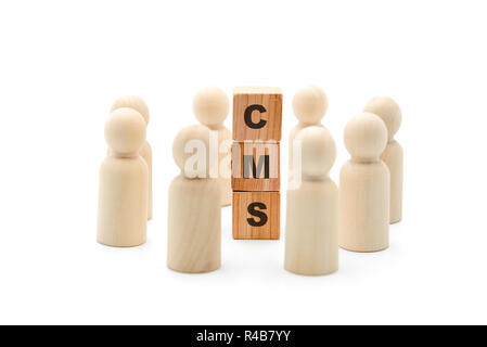 Wooden figures as business team in circle around acronym CMS Content Management System, isolated on white background, minimalist concept Stock Photo