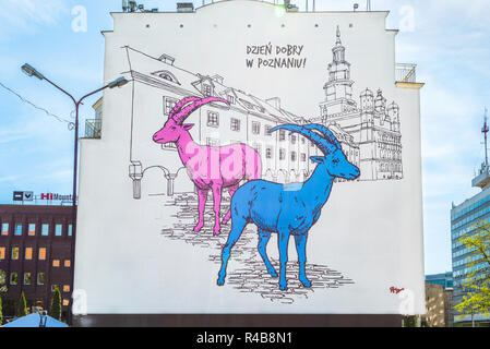 Poznan Poland city street, view of a huge image on the side of a building depicting the goats Pyrek & Tyrek - the historical mascots of Poznan city. Stock Photo