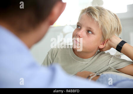 Daddy talking to his son about serious things Stock Photo