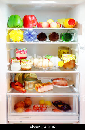 White Open Fridge with a many products Stock Photo