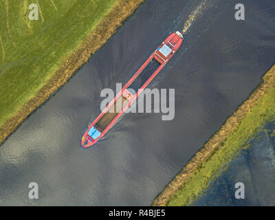 Top down view on inland cargo ship in dutch canal Stock Photo