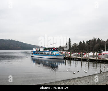 Bowness on Windermere  passenger cruise launching from the pier with day trippers aboard.England UK Stock Photo