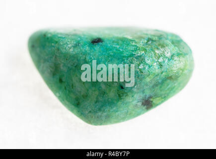 macro photography of natural mineral from geological collection - tumbled green crazy lace agate gemstone on white background Stock Photo