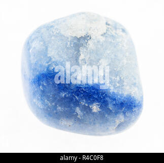 macro photography of natural mineral from geological collection - tumbled blue dyed agate stone on white background Stock Photo