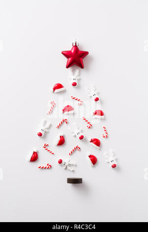 Christmas tree made with Christmas ornaments on white background Stock Photo