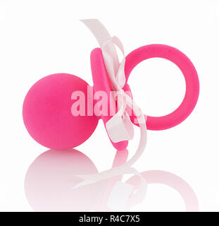 Pink decorative baby's dummy with white ribbon on it, isolated on white background with shadow reflection. Pinky pacifier on white backdrop. Lilac soo Stock Photo