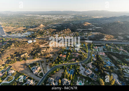 Late afternoon aerial view of homes, estates, mansions and the 118 freeway in the Chatsworth neighborhood of Los Angeles, California. Stock Photo
