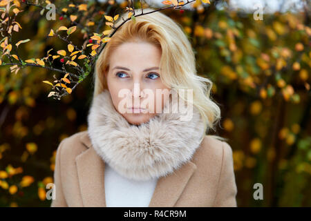 Woman walking outdoors thinking Stock Photo