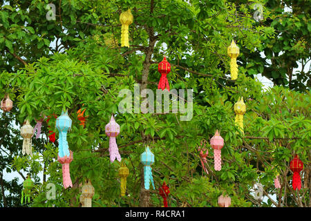 Big Tree in the Temple Courtyard Full of Colorful Paper Lanterns, Historic Place in Nan Province, Northern Thailand Stock Photo