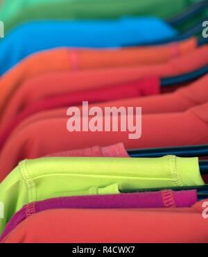 Clothing on a hangers at the shop boutique. Stock Photo