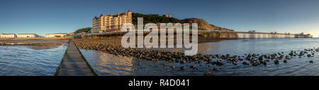 Panorama of Llandudno North Shore and pier at sunrise on the North Wales coast Stock Photo
