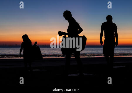 Sculptures of families on the seafront at Colwyn Bay at dawn, North Wales Stock Photo
