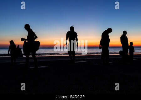 Sculptures of families on the seafront at Colwyn Bay at dawn, North Wales Stock Photo