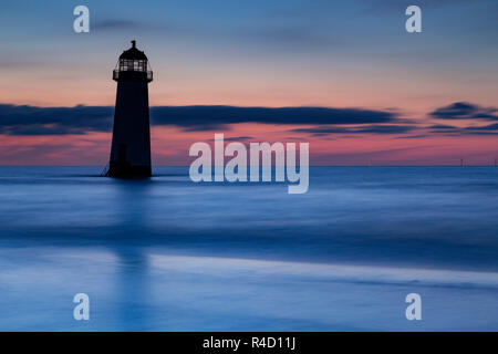 Point of Ayr lighthouse at dusk on Talacre beach, North Wales coast Stock Photo