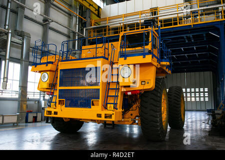 Big mining truck in the production shop of the car factory. Belaz is a Belarusian manufacturer of haulage and earthmoving equipment, dump trucks, haul Stock Photo