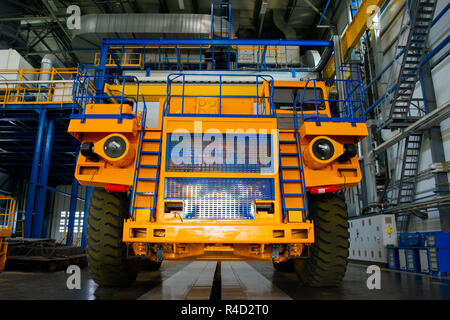 Big mining truck in the production shop of the car factory. Belaz is a Belarusian manufacturer of haulage and earthmoving equipment, dump trucks, haul Stock Photo