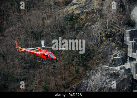 Air to air shot of aerial filming of an action movie with a V14 cineflex gyro stabilised camera mounted on a Airbus AS350B3 helicopter in the Swiss Al Stock Photo