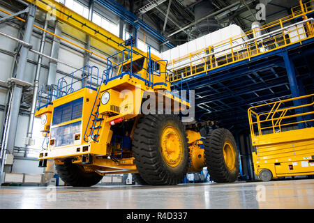 Big mining truck in the production shop of the car factory. Belaz is a Belarusian manufacturer of haulage and earthmoving equipment, dump trucks, haul Stock Photo