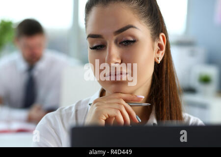 Beautiful smiling girl at workplace look in camera Stock Photo