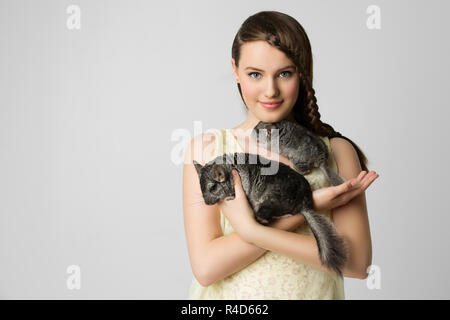 Girl with chinchillas Stock Photo