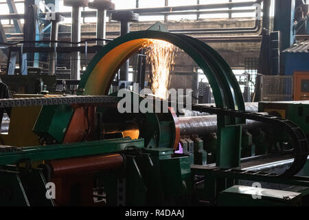 Metal lathe. Machining of metal by cutting on a turning and milling machine. The production process in an industrial factory for the production of aut Stock Photo