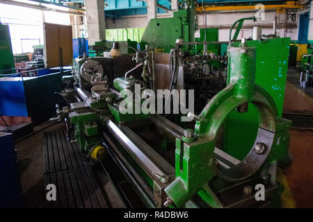 Machining of metal by cutting on a turning and milling machine. Industrial machine old design. Lathe equipment. Stock Photo
