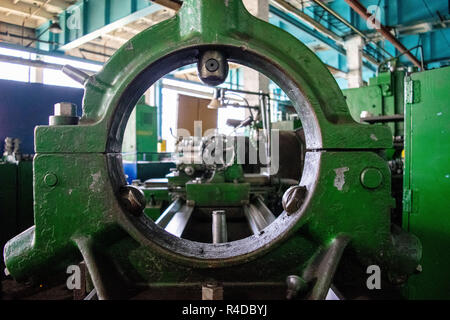 Machining of metal by cutting on a turning and milling machine. Industrial machine old design. Lathe equipment. Stock Photo