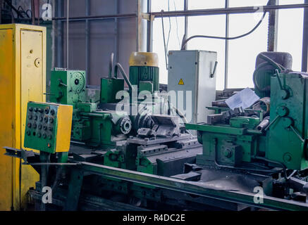 Machining of metal by cutting on a turning and milling machine. Industrial machine old design. Lathe equipment. Stock Photo