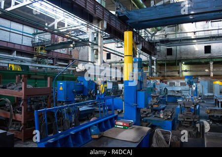 Machine shop of metallurgical works indoors room. Shop blacksmithing plant. Industrial tourism Stock Photo