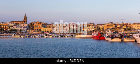 Fishing motor boat on the harbor in Palamos bay of Spain Stock Photo