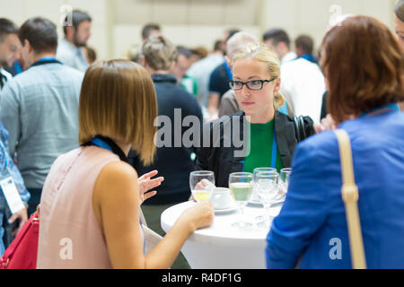 People interacting during coffee break at medical conference. Stock Photo