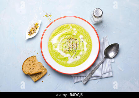 Green Vegan Broccoli Cream Soup with Cashew Milk and Seed Mix, Detox Healthy Eating, Delicious Vegetarian Meal Stock Photo