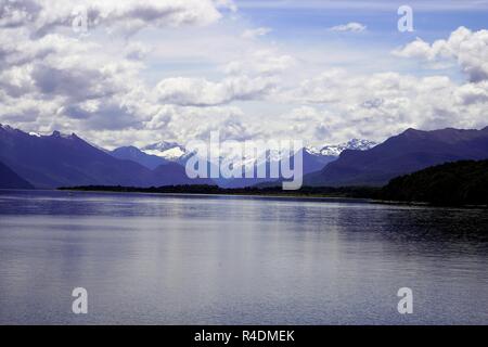 Blue lake surrounded by snowy mountains, New Zealand South Island Stock Photo