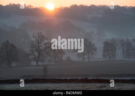 Stow on the Wold countryside at sunrise in the autumn frost. Stow on the Wold, Cotswolds, Gloucestershire, England Stock Photo