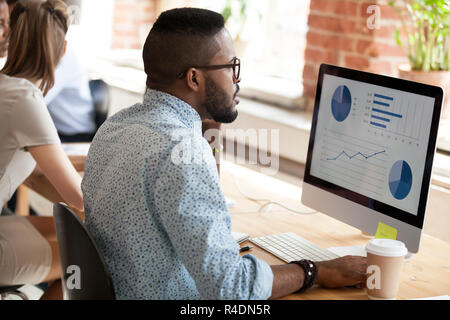 African American man talking by phone about report Stock Photo