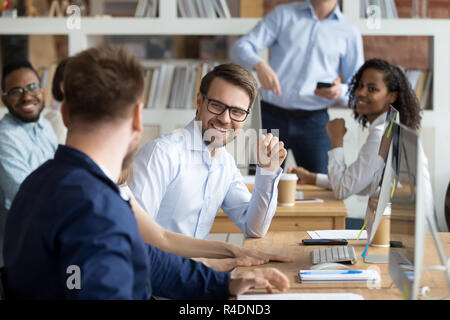 Multiracial work team having fun and laughing together Stock Photo