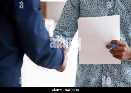 African American businessman shaking hand to employee Stock Photo