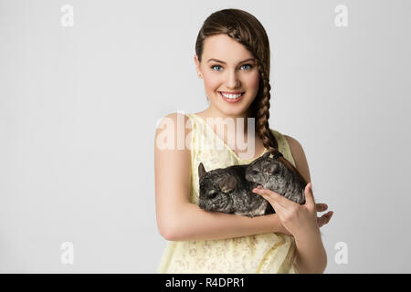 Girl with chinchillas Stock Photo