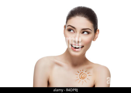 Girl with cream sun shape drawing on chest Stock Photo