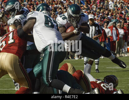 Seattle Seahawks corner back Marcus Trufant (23) reaches out for a low  tackle attempt of Philadelphia Eagles running back Correll Buckhalter (28)  during first quarter play at Philadelphia's Lincoln Field December 2