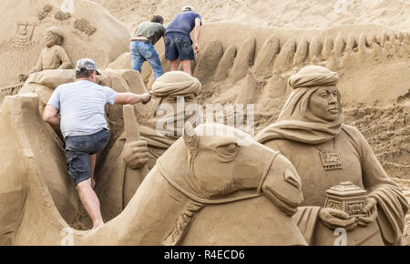 Las Palmas, Gran Canaria, Canary Islands, Spain. 27th November 2018. A team of eight internationally renown sand sclulptors work on a huge nativity scene on the city beach in Las Palmas. The 75 x 30 metre nativity scene annually attracts around 200,000 visitors. The nativity scene opens to the public on 30th November Credit: ALAN DAWSON/Alamy Live News Stock Photo